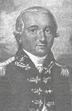 Black and white print shows a round-headed man dressed in a dark military uniform with lace frogging on the front. He wears an 18th century wig.