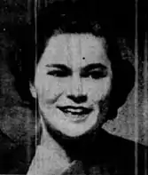 A newspaper photograph of a young smiling white woman with short dark hair, from 1948.