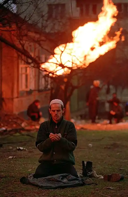 Image 4Chechen separatist fighter praying during the First Chechen WarCredit:Mikhail Evstafiev