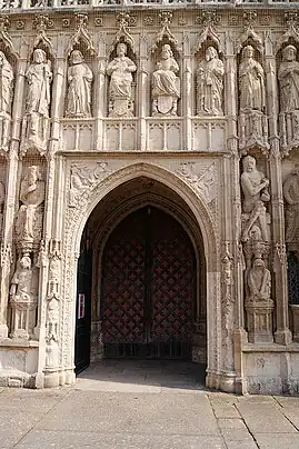  An arched doorway surrounded by tiers of carved  figures