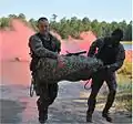 530th Soldiers negotiate a 400-meter buddy team poncho raft swim as part of the Expert Sapper Competition