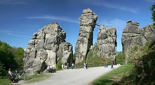 Image 12ExternsteinePhoto credit: Daniel SchwenThe Externsteine, a distinctive rock formation located in the Teutoburger Wald region of northwestern Germany, are a popular tourist attraction. Stairs and a small bridge connecting two of the rocks lead to the top.