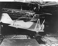 A Sparrowhawk secured in the hangar aboard Akron