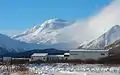 False Pass School and Roundtop volcano.