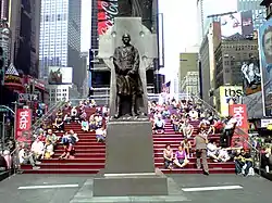 The red steps behind the statue of Father Duffy are the roof of the TKTS booth