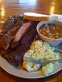 Ribs, potato salad, baked beans, and bread