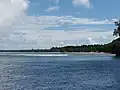 Looking north to Fenualoa from just outside the reef.  Tuo village is just visible.