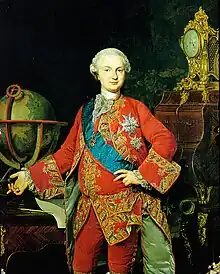 Adolescent boy in gilded red courtly robes, hair powdered white, standing next to a table with a globe on it, with various military decorations..