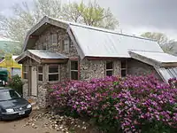 A finished slipform stone house.