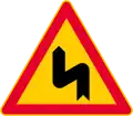 Dangerous curves, first bend to left  (formerly used )