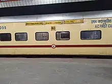 A yellow ICF coach used on the Nauchandi Express