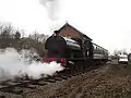 The Pecket and passenger coach passes the goods shed during the Whitwell station reopening.