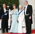 President George W. Bush and First Lady Laura Bush with Queen Elizabeth II and Prince Philip, Duke of Edinburgh at the beginning of an official dinner at the White House, 2007