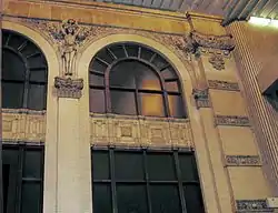 The atrium above the rapid-transit train platforms for Five Points (MARTA station), Atlanta, Georgia, features the original facade of the Eiseman Building, which was demolished to make way for the station in 1975.