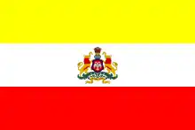 Flag with 3 bars of yellow, white and red with Karnataka's state emblem in the middle of the white bar