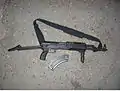 AKMS with commercial Picatinny rail fore-stock and folding pistol-grip attachment