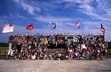 A chainlink fence covered in mementos and flags dedicated to the flight 93 crash