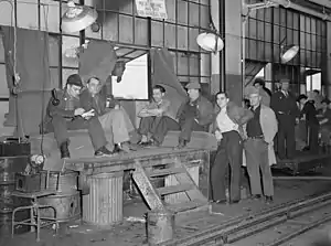 Image 10Union members occupying a General Motors body factory during the Flint Sit-Down Strike of 1937 which spurred the organization of militant CIO unions in auto industry (from History of Michigan)