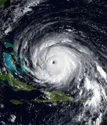 A view of Hurricane Floyd from Space on September 13, 1999. The storm is mature and well-defined, with a pronounced eye feature. Floyd is located over the Atlantic Ocean, and to the north and east of Cuba and Florida, respectively.