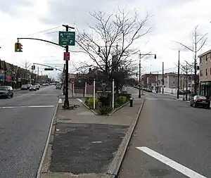 A traffic island where Flushing and Grand Avenues split