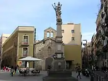 Column and statue in an older part of the city