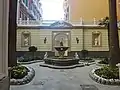 Fountain into a historical palace in Gramsci street