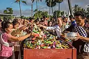 Day of the ghosts (Boun kao padap din), the people of the village of Don Det offer rice, biscuits and home-made cakes to the monks at the temple.