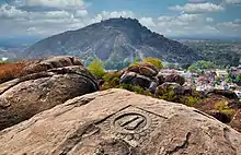 The Footprints of Chandragupta Maurya on Chandragiri hill Hill, where Chandragupta (the unifier of India and founder of the Maurya Dynasty) performed Sallekhana.