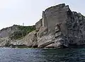 Rock formation called "Le Vieux" (the Old Man) and Cap Gaspé lighthouse