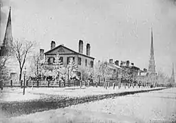 SW Corner of Griswold and Fort Streets (current location of the Greater Penobscot Building), c. 1870. The house in the foreground was constructed for John Palmer in 1829 and demolished in 1869