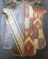 Arms of Richard Fortescue (d. 1570) from Weare Giffard overmantel now at Simonsbath House. The arms of his wife are shown impaled in the sinister half as follows: 1st & 4th grand quarters: quarterly 1st & 4th: Gules, a goat's head erased argent armed or; 2nd & 3rd: Ermine (Moreton); 2nd & 3rd grand quarters: Gules, a chevron between three stag's heads cabossed or (Hagget of Kent)