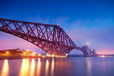 Image 12The Forth Bridge is a cantilever railway bridge over the Firth of Forth. It was opened on 4 March 1890, and spans a total length of 2,528.7 metres (8,296 ft). It is often called the  Forth Rail Bridge or Forth Railway Bridge to distinguish it from the Forth Road Bridge.Photo credit: George Gastin