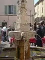 Barrel fountain in Basse-sur-Issole (1542).  The iron rods over the fountain were designed to support jars and jugs as they were filled with water pouring from canons above.