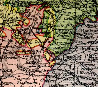 Detail of map from Philips' New handy general Atlas, 1921, showing four counties meeting at the Four Shire Stone. Worcestershire is shown in yellow, Warwickshire in green, Oxfordshire in violet and Gloucestershire in pink.