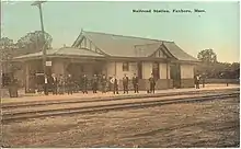 Postcard view of a small railroad station