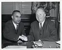 Belotti shakes hands with Boston Mayor John F. Collins in Collins's office at the Old Boston City Hall (circa 1962)