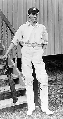 Frank Woolley standing with his bat