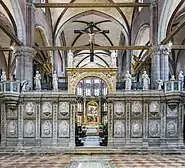 The painting seen through the arch in the choir-screen
