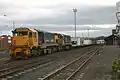 DFT 7295 and DC 4847 departing Dunedin with a freight train.