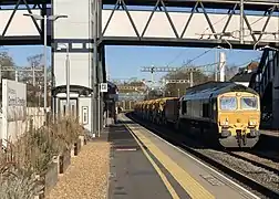 A freight train passes Goring & Streatley, Nov 2021