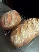 Scored loaves of artisan French-style country bread