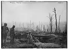 Photograph of French soldiers waiting in a trench.