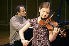 O'Riley (back) accompanying violinist Alice Ivy-Pemberton, 2009