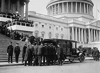 Champ Clark's casket being loaded into a hearse outside the United States Capitol, flag at half staff, March 5, 1921