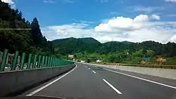 Westbound G56 Hangzhou–Ruili Expressway in the county at the 1,414 km (879 mi) post