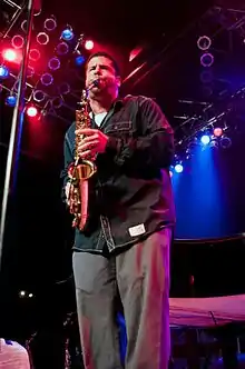 Bello playing saxophone live