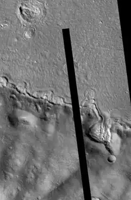 Galaxius Mons, as seen by HiRISE.  The black line was a section that was not imaged.  There are many more details visible on the original image.