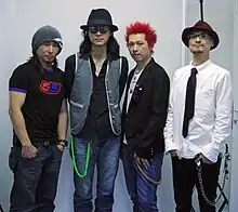 Image of four band members