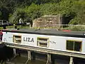 Canal Boat next to Pill Box at Garston Lock.