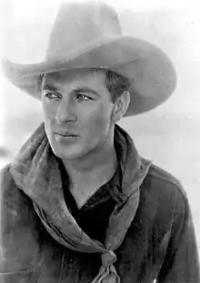 Man in dark shirt and cowboy hat